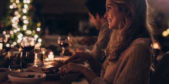 Beautiful woman having christmas dinner with family